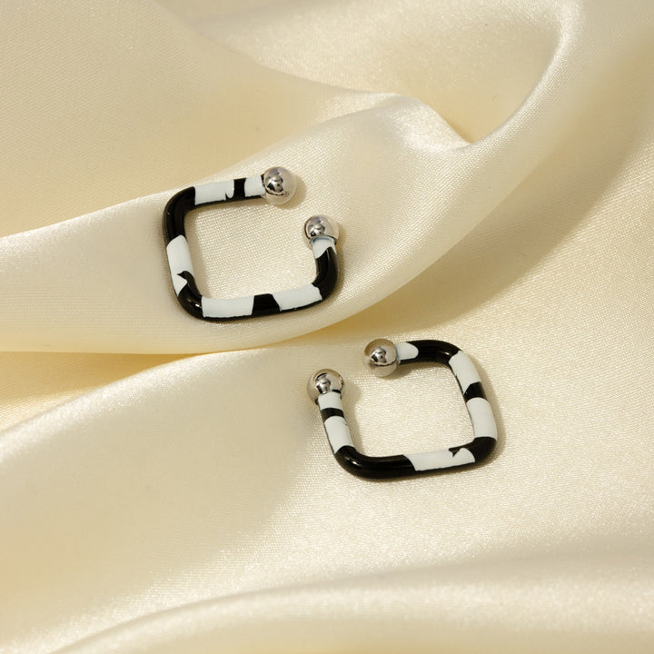 Women's Elegant Oil Drip Stainless Steel Earrings"?