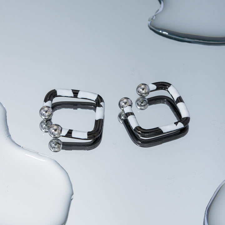 Women's Elegant Oil Drip Stainless Steel Earrings"?